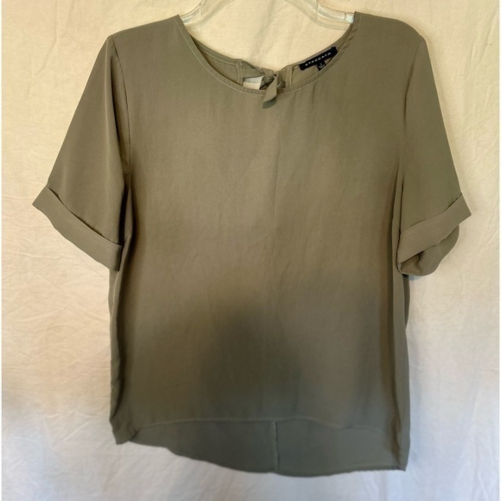 Staccato green blouse with tie back closure. Size large